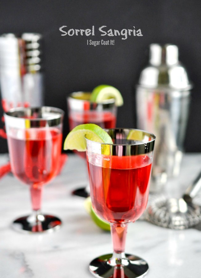 Silver-rimmed glasses with jewel red sorrel sangria | I Sugar Coat It