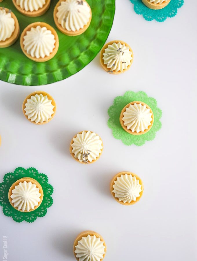 These mouthwatering Lemon Lavender Coconut Mousse Mini Tarts are summer in bite-size sweet pastry, filled with fresh curd and topped with a dreamy mousse!