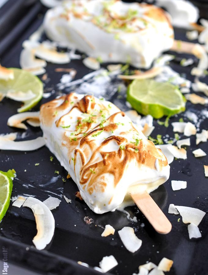Creamy, tart and sweet Key Lime Curd Meringue Popsicles clad in lightly toasted meringue - basically, a pie on a stick!