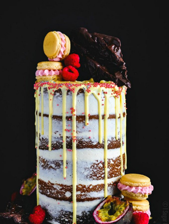 Passion Fruit Raspberry Naked Birthday Cake. Six layers of vanilla bean passion fruit cake filled with raspberry compote and brown butter buttercream.