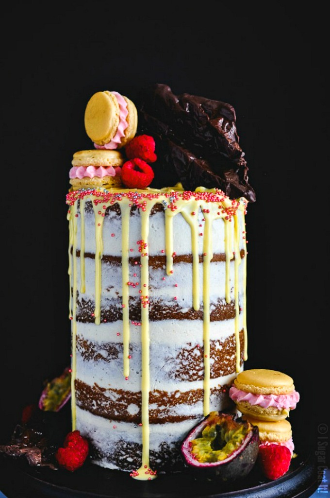 Passion Fruit Raspberry Naked Birthday Cake. Six layers of vanilla bean passion fruit cake filled with raspberry compote and brown butter buttercream.