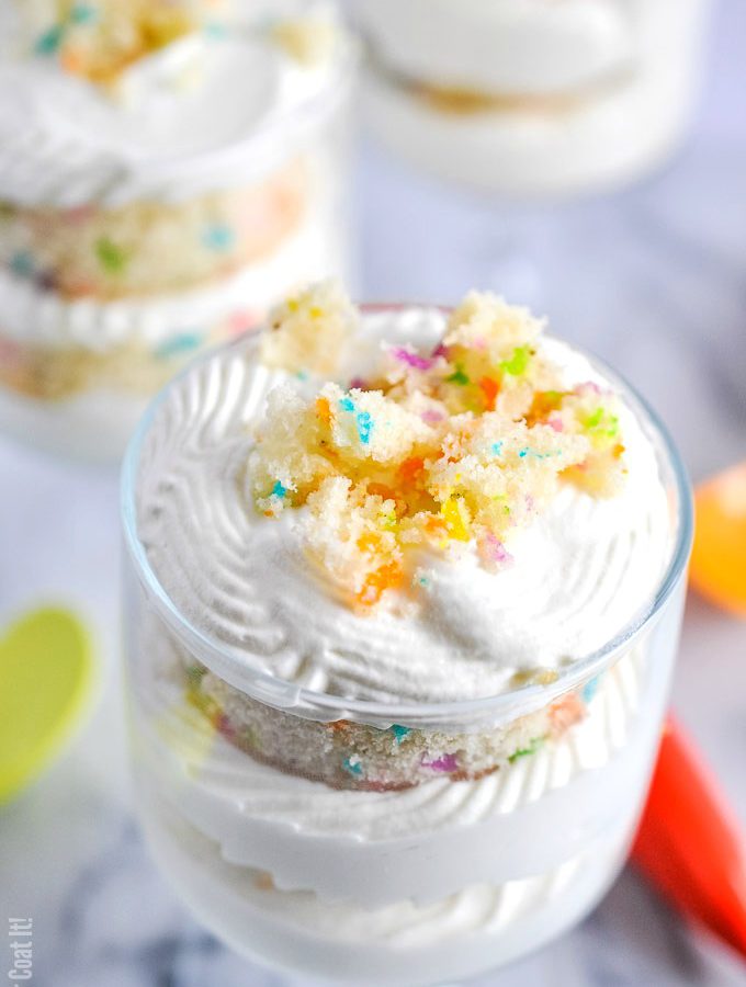 Funfetti White Chocolate Mousse Trifle are layers of funfetti vanilla cake, pineapple curd and an easy 2-ingredient white chocolate mousse, stacked in single-serve sized trifles.