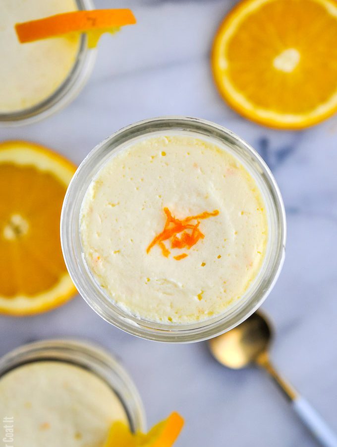 Single-serve jars of ginger cookie base and velvety, light-as-air Sous Vide Orange Mascarpone Cheesecake made with #TrestelleCheese.