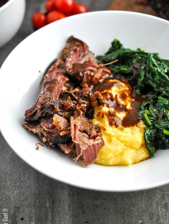 Slow-cooked to fall-off-the-bone, succulent perfection, Sous Vide Goat Shoulder with Polenta, Wilted Spinach and Garlic delivers flavourful comfort.