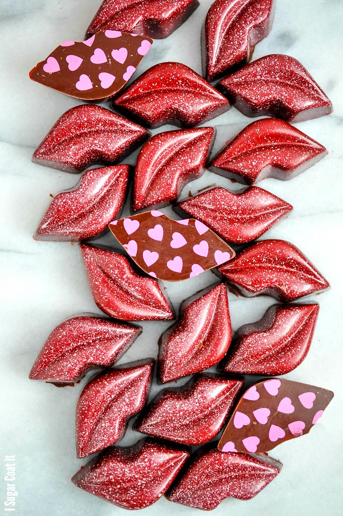 Strawberry Balsamic Chocolate Kisses bonbons are a layer of fruity, tart, balsamic reduction atop a silky, pretty pink ganache, wrapped in chocolate lips.