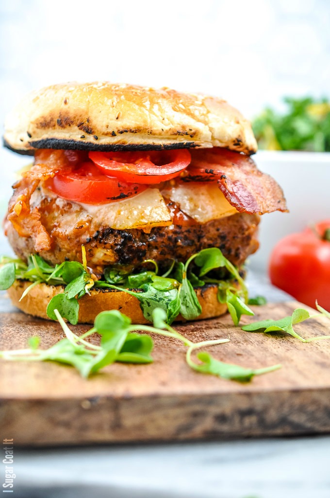 homemade burger topped with bacon, tomato and microgreens | i sugar coat it